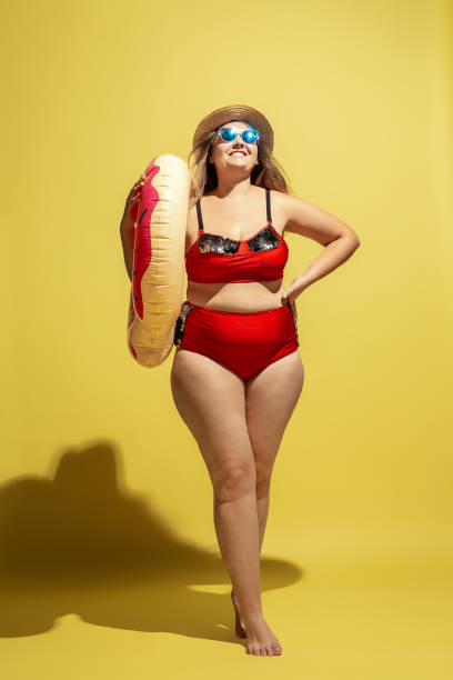 istock Young caucasian plus size female model's preparing for beach resort 1177225270