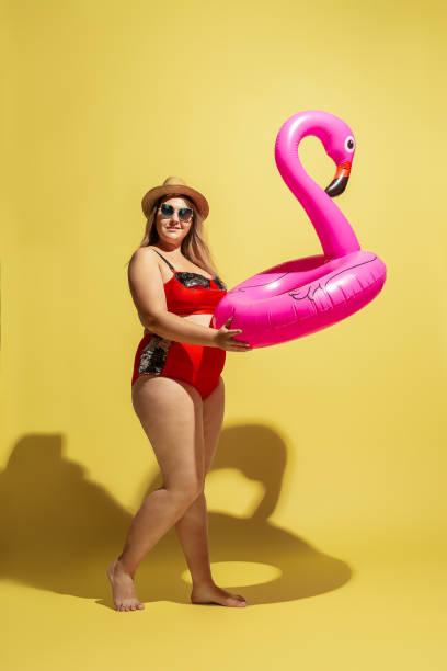 istock Young caucasian plus size female model's preparing for beach resort 1177225273