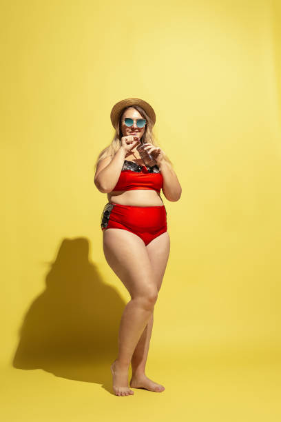 istock Young caucasian plus size female model's preparing for beach resort 1177225279