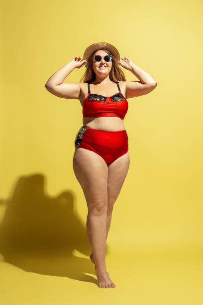istock Young caucasian plus size female model's preparing for beach resort 1177225280