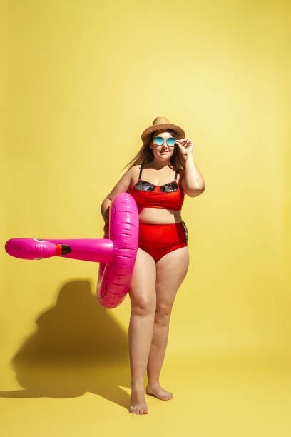 istock Young caucasian plus size female model's preparing for beach resort 1177225282