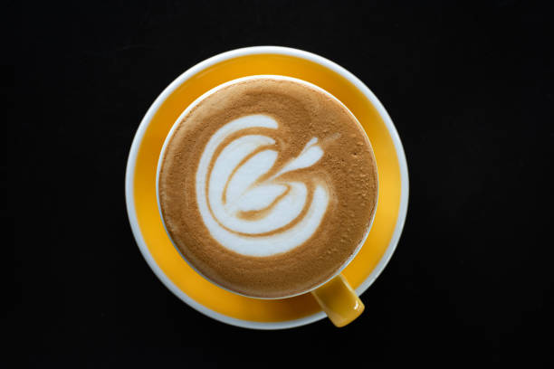 istock A cup of coffee with beautiful latte art on black table background. 1177227635