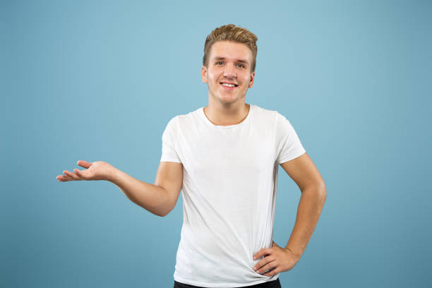 istock Caucasian young man's half-length portrait on blue background 1177227836