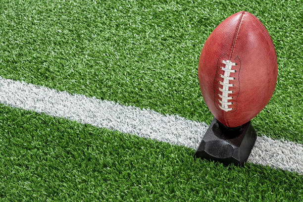 istock Professional American Football on kicking tee 1177228170