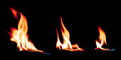 Hot fire flames burning on a pure black background. Bright ignition fire effect.