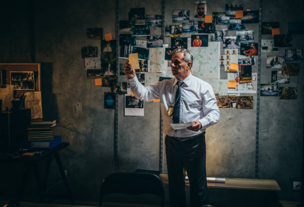 istock Mature detective working late in office 1177230548