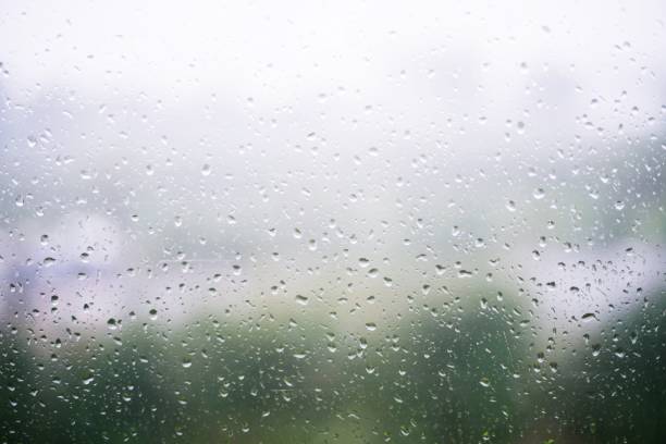 istock Drops Of Rain on window glass with blur background 1177231662