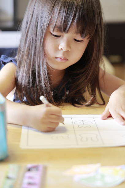 istock studying Japanese girl at home (4 years old) 1177232745