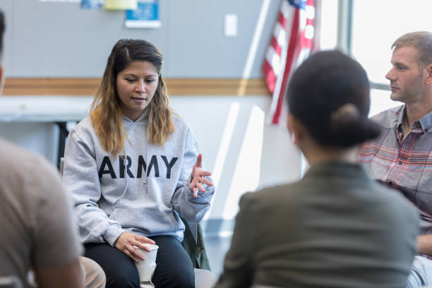 istock Vulnerable female veteran shares during support group 1177233327