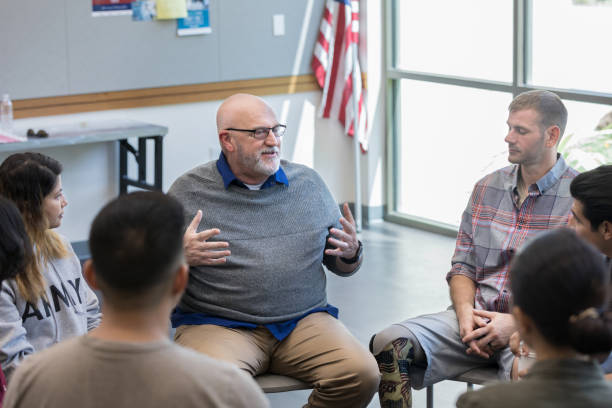 istock Senior veterans discusses something with young veterans 1177233341