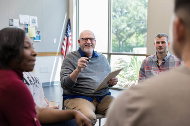 istock Senior male therapist facilitating support group 1177233344