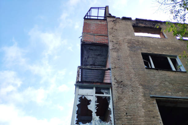 istock House with broken windows and damaged walls. Concept- war, devastation, disasters, emergencies. 1177235052
