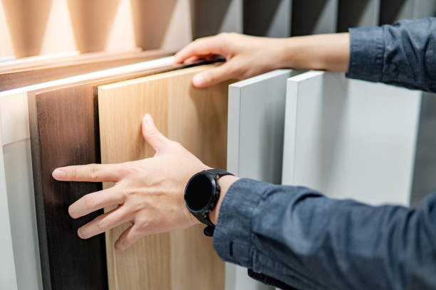 Male hand choosing cabinet or countertop materials