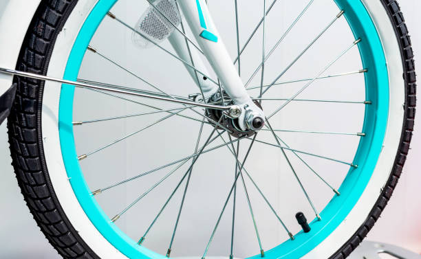 istock Bicycle wheel with metal spokes and turquoise rim 1177235342