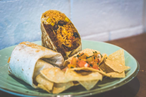 istock Double Chilli Cheese Beef Burrito Tender pulled beef, mozzarella black beans, and Mexican rice wrapped in a flour tortilla served with tortilla chips 1177237487