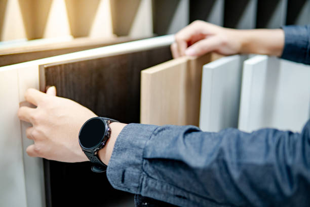 istock Male hand choosing cabinet or countertop materials 1177238456