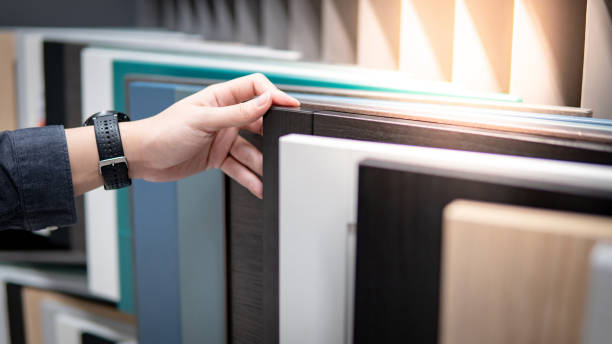 istock Male hand choosing cabinet or countertop materials 1177238552