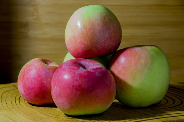 istock Image of apples on a beige, wooden background. 1177239981