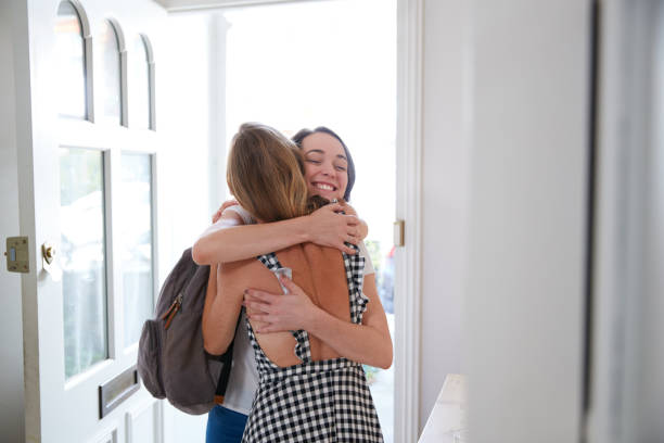 istock Woman Opening Front Door And Greeting Gay Partner As She Comes Home From Work 1177240777