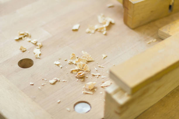 istock Workbench working table in wood workshop carpentry with wood shavings and planer 1177242188