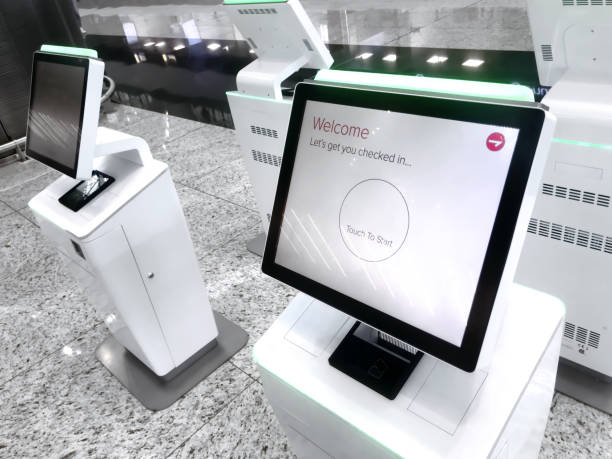 check in kiosks - airport check in counter imagens e fotografias de stock