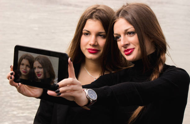 istock Women taking a selfie with a digital tablet 1177242899