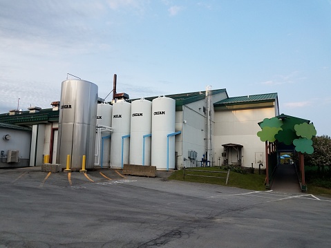 sguar, milk, and cream silos or storage tanks at milk and ice cream factory