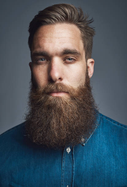 istock Confident young hipster standing against a gray background 1177246537