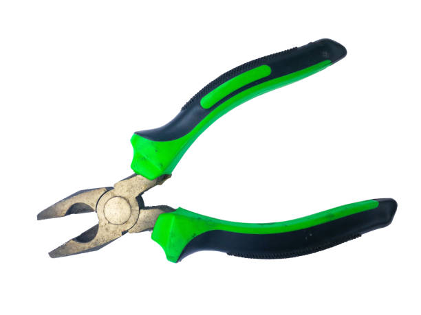 istock Dirty old  pliers black and green handle 1177246661