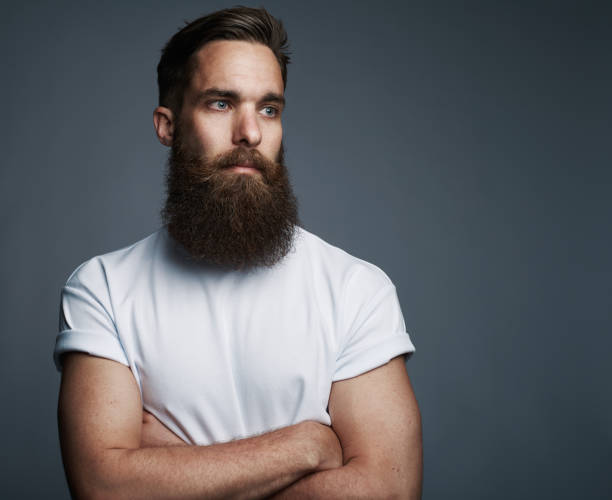 istock Confident young man standing with his arms crossed 1177246729