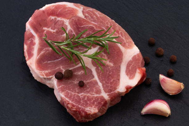 istock Raw meat,  steak with spices on black background 1177249222