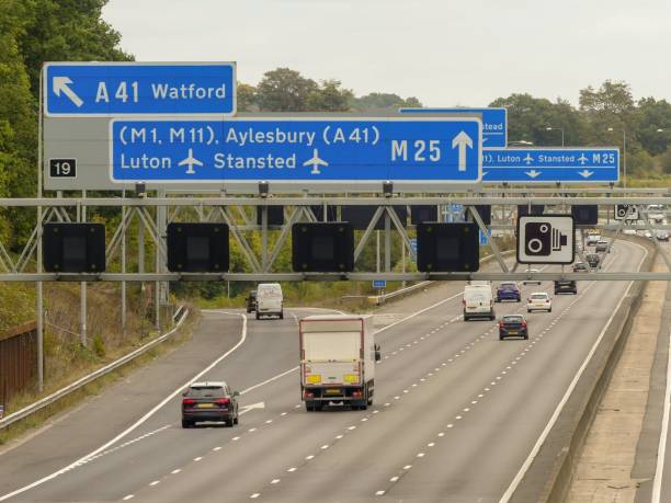 M25 London Orbital Motorway signs at Junction 19 for Watford A41, Luton Airport M1, Stansted Airport M11 and Aylesbury A41 This photo was taken in Chandler's Cross, Herfordshire, England, UK essex england photos stock pictures, royalty-free photos & images