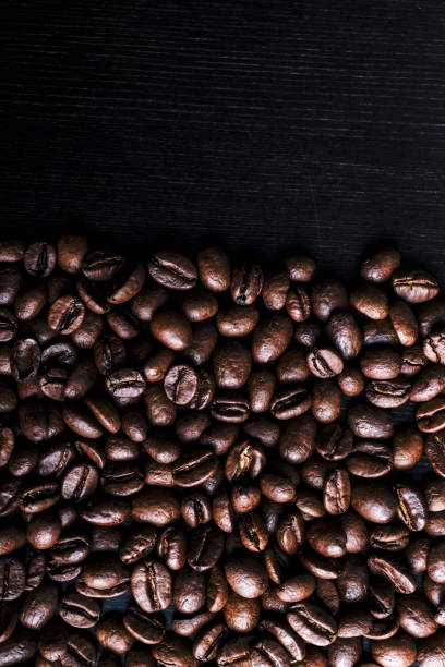 istock Coffee beans on wooden background. Macro. 1177250754
