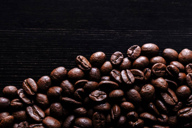 istock Coffee beans on wooden background. Macro. 1177250801