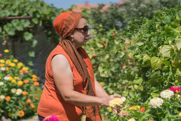 istock Happy woman gardening in backyard. 1177250828