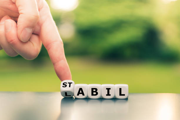 istock Hand turns a dice and changes the German word 
