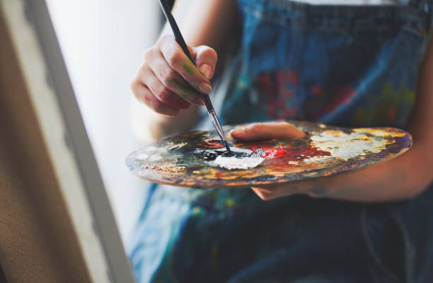 istock Woman painting 1177252012