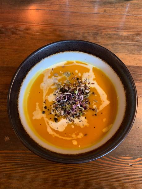 istock Pumpkin soup in a bowl on the wooden table 1177252306