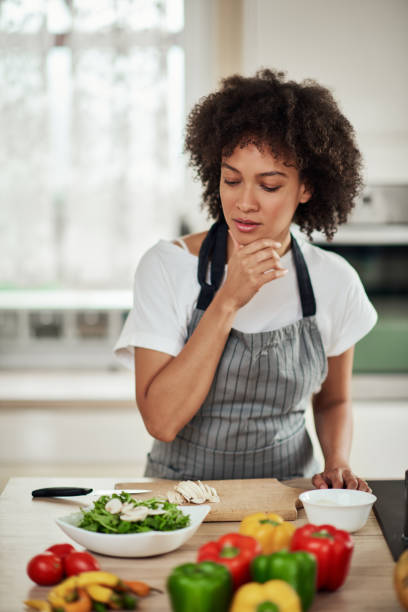 istock Mixed race woman searching ingredients for dinner. 1177252901