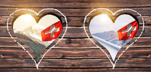 istock Summer and winter view through a heart window on a pasture in Switzerland 1177253581