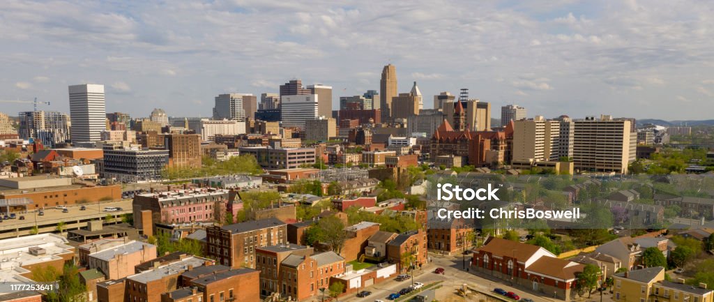 Beautiful Sunny Day over The Downtown Urban Center of Cincinnati Ohio High over the streets buildings and homes in the midwestern town of Cincinnati Ohio USA Cincinnati Stock Photo