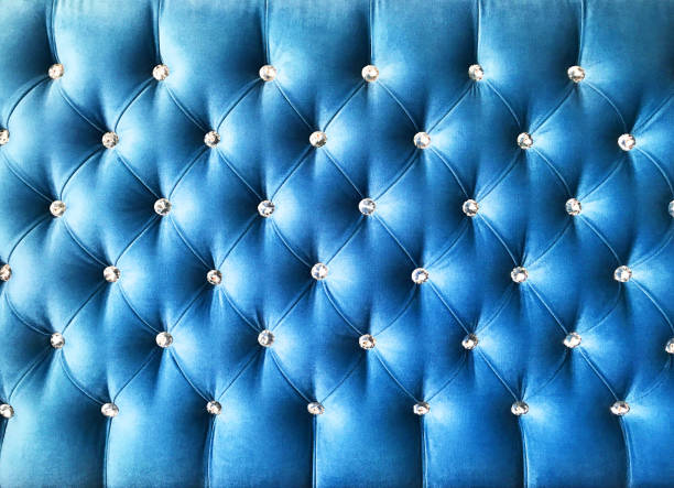 Elegant blue quilted textile wall with jewelry buttons