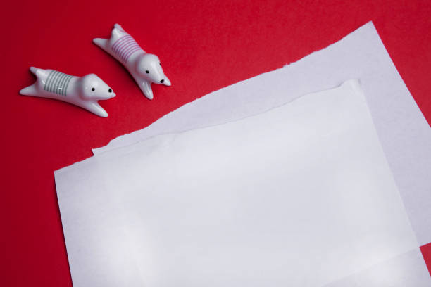 istock torn and crumpled paper on a red background. 1177256273