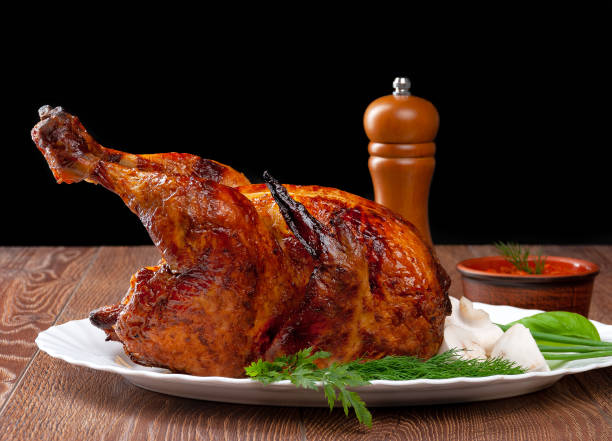 istock image of delicious roasted chicken on wood background 1177256942