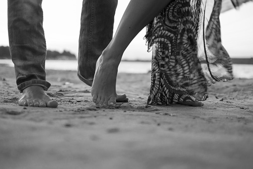 Dance with me. Bare foot dance on the sand. Couple dancing. Man and woman love play. Learn how to dance with someone.