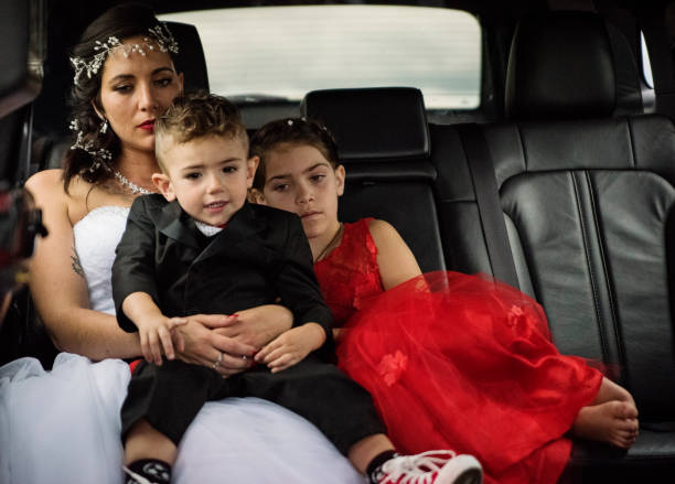 istock Millennial bride in limousine on her way to wedding. 1177261530