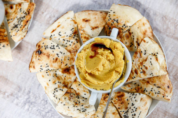 istock Hummus with pita bread, top view. 1177261608