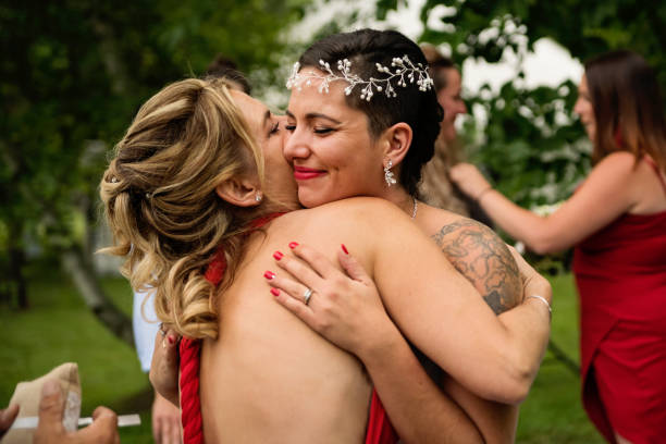 istock Millennial bride hugging mother after wedding outdoors. 1177261793