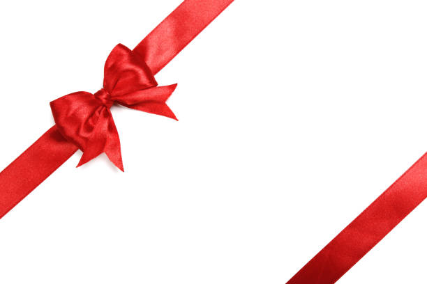 glänzendes rotes satinband auf weißem hintergrund - bow christmas gift holiday stock-fotos und bilder