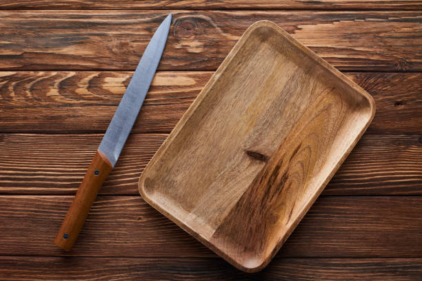 istock top view of empty rectangular dish near knife on brown wooden surface 1177265778